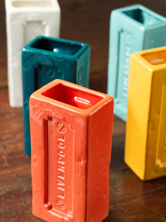 Group of five Liverpool Brick Vases in assorted colours